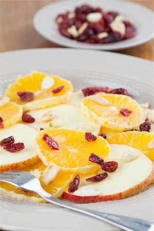 Healthy orange and apple salad with dried cranberries and roasted almonds Stock Photo - Budget Royalty-Free & Subscription, Code: 400-06738632