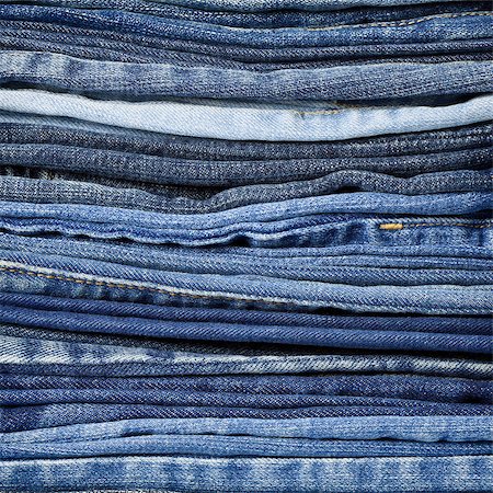 simsearch:400-07770306,k - Jeans trousers stack closeup Foto de stock - Royalty-Free Super Valor e Assinatura, Número: 400-06739364