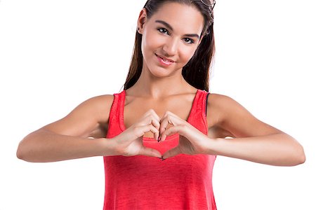 Beautiful woman making a heart symbol with her hands, isolated on white background Foto de stock - Super Valor sin royalties y Suscripción, Código: 400-06739975