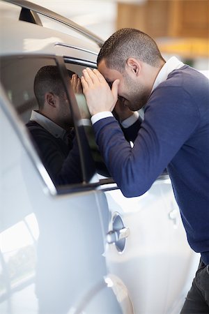 Customer looking inside a car in a garage Stock Photo - Budget Royalty-Free & Subscription, Code: 400-06733766