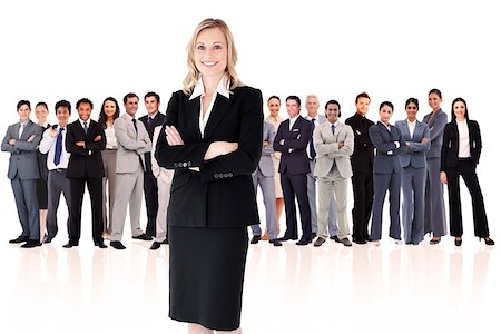 Businesswoman standing up with colleagues in background Stock Photo - Budget Royalty-Free & Subscription, Code: 400-06733912