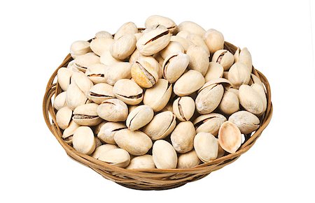 simsearch:400-07210943,k - Pistachio nuts in a wicker plate, isolated on a white background Stock Photo - Budget Royalty-Free & Subscription, Code: 400-06744155