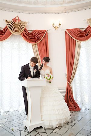 couple signing a wedding document Stock Photo - Budget Royalty-Free & Subscription, Code: 400-06744950
