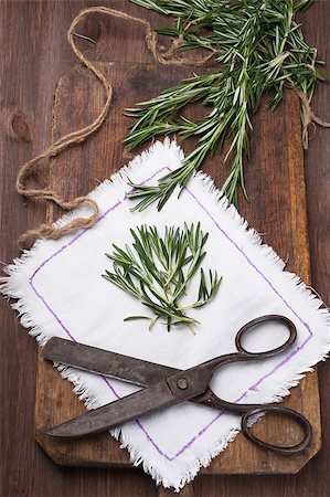 Rosemary on a light napkin next to the old scissors Stock Photo - Budget Royalty-Free & Subscription, Code: 400-06745600