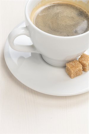 simsearch:400-07477800,k - cup of espresso with cane sugar, on table Fotografie stock - Microstock e Abbonamento, Codice: 400-06746321