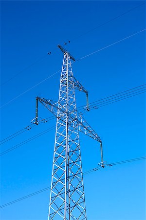 simsearch:400-06741736,k - Electrical high-voltage metal pillar against the background of blue cloudless sky Stock Photo - Budget Royalty-Free & Subscription, Code: 400-06746833