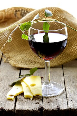 simsearch:400-06461717,k - glass of red wine and slices of cheese on a wooden table Stock Photo - Budget Royalty-Free & Subscription, Code: 400-06747585