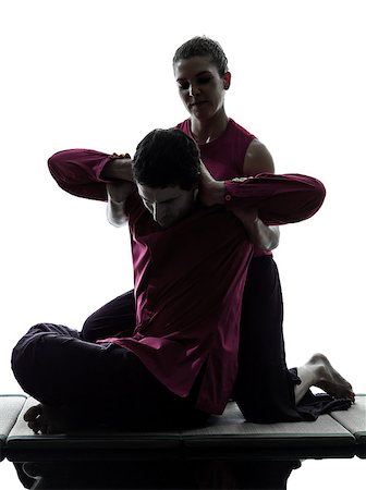 shiatsu - one man and woman performing thai massage in silhouette studio on white background Foto de stock - Super Valor sin royalties y Suscripción, Código: 400-06748152