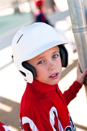 Little league baseball player in the dugout waiting to bat. Stock Photo - Budget Royalty-Free & Subscription, Code: 400-06740667