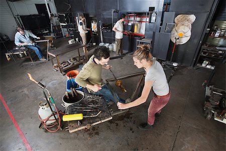 simsearch:400-06796868,k - Two young glass artisans with tools in workshop Foto de stock - Super Valor sin royalties y Suscripción, Código: 400-06741240