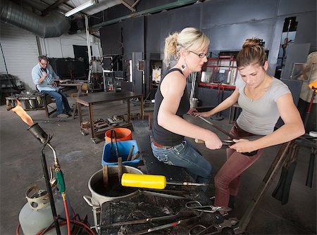 Pair of artisans working with tools in glass art workshop Stock Photo - Budget Royalty-Free & Subscription, Code: 400-06741241