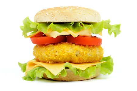 Classic Burger with Breaded Chicken, Tomatoes, Lettuce and Cheese on Sesame Bun isolated on white background Stock Photo - Budget Royalty-Free & Subscription, Code: 400-06741659