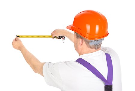 simsearch:400-06741696,k - manual worker with tape measure over white background. Photographie de stock - Aubaine LD & Abonnement, Code: 400-06741695