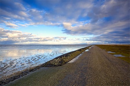 road by North sea close to Moddergat in Netherlands Stock Photo - Budget Royalty-Free & Subscription, Code: 400-06741974