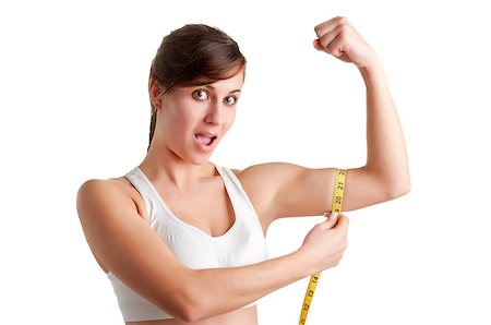 pic of girls with biceps - Shocked Woman measuring her Biceps, isolated in a white background Stock Photo - Budget Royalty-Free & Subscription, Code: 400-06743845