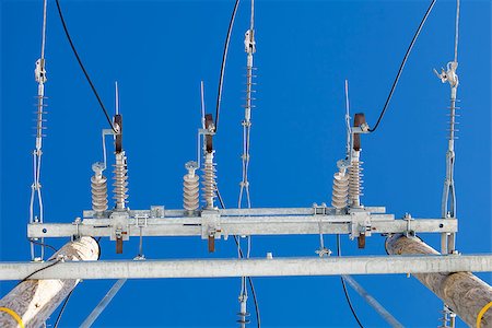 electricity pole - Electricity dis connector,insulators on a blue sky background Stock Photo - Budget Royalty-Free & Subscription, Code: 400-06743862
