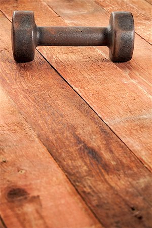simsearch:400-07620929,k - vintage iron rusty dumbbells on weathered red barn wood background - fitness concept Stock Photo - Budget Royalty-Free & Subscription, Code: 400-06758921