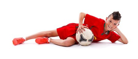 simsearch:400-04325504,k - Young boy lying with soccer ball, studio shot Fotografie stock - Microstock e Abbonamento, Codice: 400-06759420