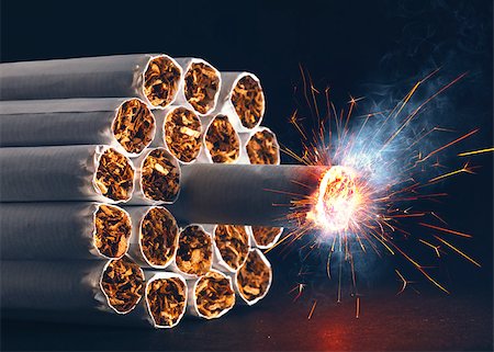 A pack of cigarettes in the form of dynamite ready to explode. Stock Photo - Budget Royalty-Free & Subscription, Code: 400-06759490