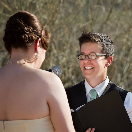 Happy lesbian lady reading vows to bride Stock Photo - Budget Royalty-Free & Subscription, Code: 400-06759984