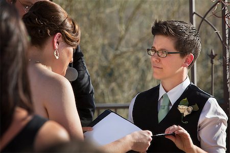 Lesbian partners reading marriage vows in ceremony Stock Photo - Budget Royalty-Free & Subscription, Code: 400-06759986