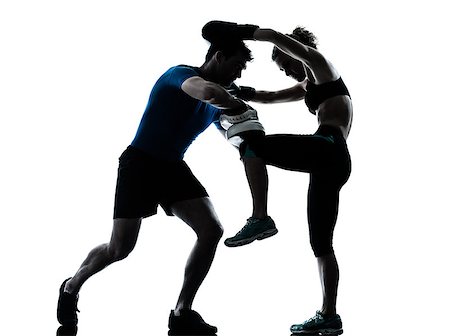 one caucasian couple man woman personal trainer coach man woman boxing training silhouette studio isolated on white background Stock Photo - Budget Royalty-Free & Subscription, Code: 400-06750081