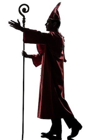 priest blessing - one man cardinal bishop silhouette saluting blessing in studio isolated on white background Stock Photo - Budget Royalty-Free & Subscription, Code: 400-06750117