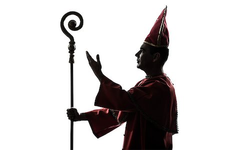 priest blessing - one man cardinal bishop silhouette saluting blessing in studio isolated on white background Stock Photo - Budget Royalty-Free & Subscription, Code: 400-06750118