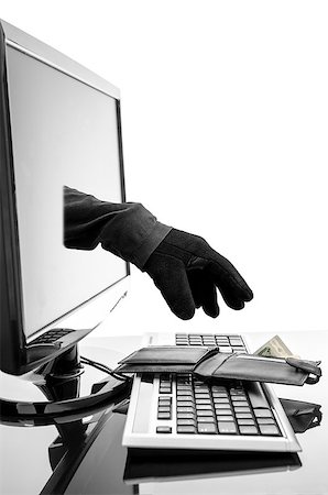 simsearch:400-08729802,k - Gloved hand of a thief stealing wallet through a computer screen. Concept of internet crime. Stock Photo - Budget Royalty-Free & Subscription, Code: 400-06750224