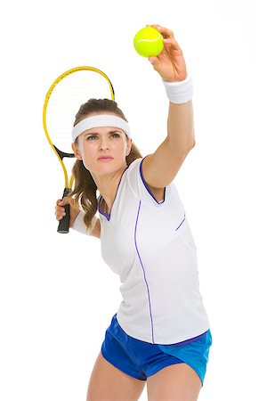 Confident female tennis player serving ball Stock Photo - Budget Royalty-Free & Subscription, Code: 400-06750344