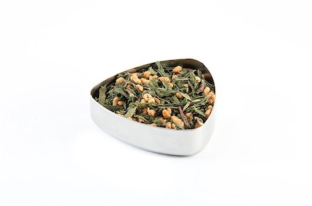 dry cured - Genmai Cha, also known as "brown rice teaâ?. Japanese green tea mixed with toasted rice in a metal container. Stock Photo - Budget Royalty-Free & Subscription, Code: 400-06750374