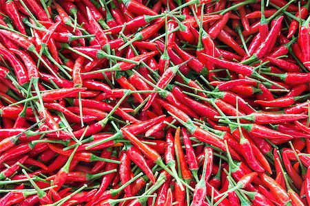 Thai Fresh Red Chili Peppers Background Stock Photo - Budget Royalty-Free & Subscription, Code: 400-06750679