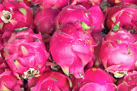 stores in singapore - Dragon Fruit Pitahayas at Fruit and Vegetables Stand in Southeast Asian Market Closeup Background Stock Photo - Budget Royalty-Free & Subscription, Code: 400-06750778
