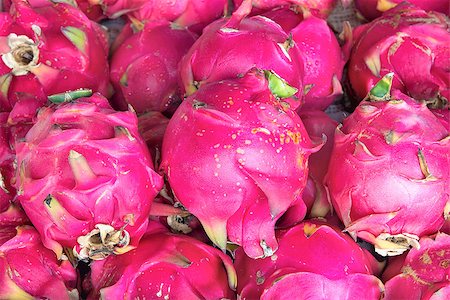 Dragon Fruit Pitahayas at Fruit and Vegetables Stand in Southeast Asian Market Closeup Background Foto de stock - Super Valor sin royalties y Suscripción, Código: 400-06750778