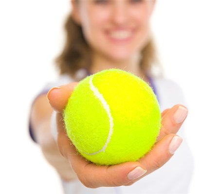 Closeup on ball in hand of happy female tennis player Stock Photo - Budget Royalty-Free & Subscription, Code: 400-06751508