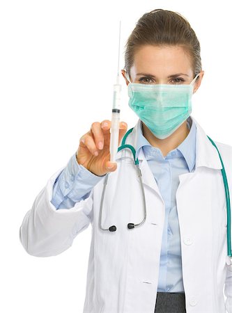 simsearch:400-04129952,k - Medical doctor woman in mask showing syringe Stockbilder - Microstock & Abonnement, Bildnummer: 400-06751510