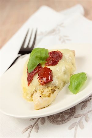 side dish with chicken - baked chicken with mozzarella, dried tomatoes and basil leaves Stock Photo - Budget Royalty-Free & Subscription, Code: 400-06751940