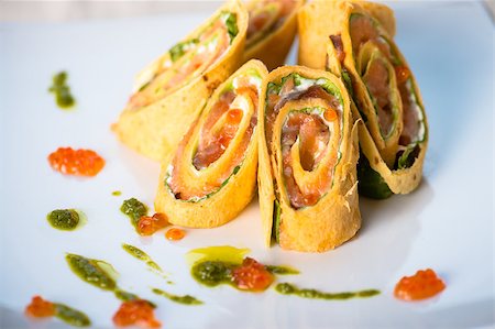 wrapped up red fish and caviar on the plate Fotografie stock - Microstock e Abbonamento, Codice: 400-06764817