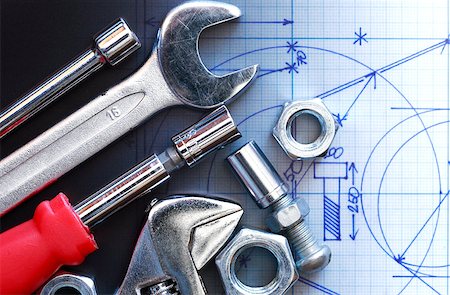 drafting tool - Closeup of work tools near screw nuts on graph paper with draft Stock Photo - Budget Royalty-Free & Subscription, Code: 400-06764987