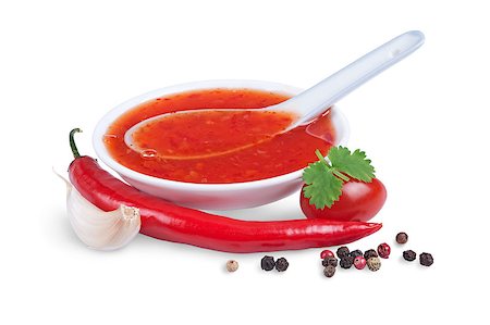 red pepper and garlic - red hot chilli sauce  isolated on a white background Stock Photo - Budget Royalty-Free & Subscription, Code: 400-06765196