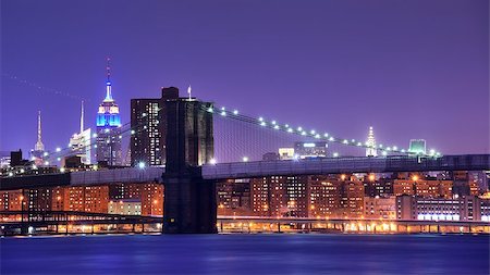simsearch:400-06866506,k - Brooklyn Bridge and famed skyscrapers in New York City Stock Photo - Budget Royalty-Free & Subscription, Code: 400-06765400