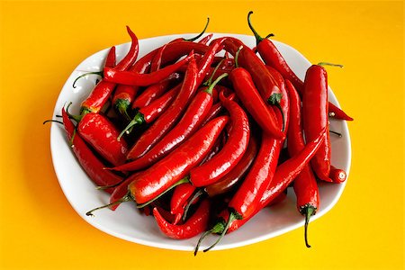 fmgk (artist) - Hot red pepper chili on white plate over yellow background Stock Photo - Budget Royalty-Free & Subscription, Code: 400-06765596