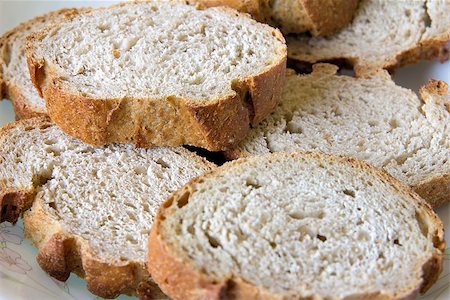 sour dough bread - Sliced Sour Dough Whole Wheat French Bread on a Plate Closeup Stock Photo - Budget Royalty-Free & Subscription, Code: 400-06765917