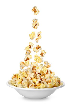 popcorn white background - Popcorn falling in the plate. Isolated on white background Stock Photo - Budget Royalty-Free & Subscription, Code: 400-06766093