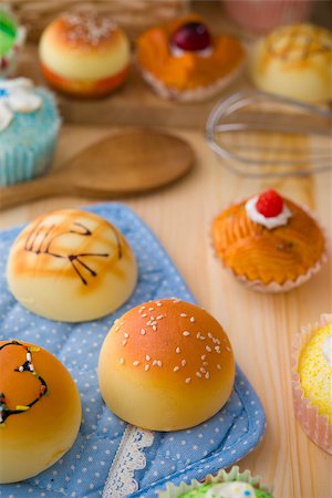 simsearch:400-05079087,k - sweet vanilla bun cake bread with pastry decorations as background Stock Photo - Budget Royalty-Free & Subscription, Code: 400-06767377