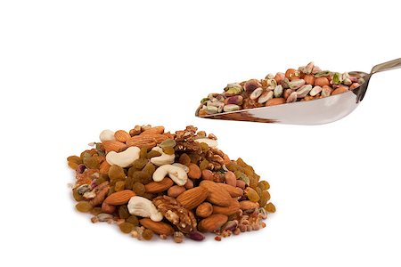 simsearch:400-04181279,k - Pile of mix collection of dry fruits falling from steel spoon isolated over white Foto de stock - Super Valor sin royalties y Suscripción, Código: 400-06767629
