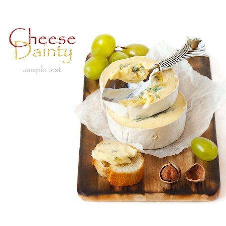 simsearch:400-04184502,k - Delicious soft cheese, nuts and grape on an old cutting board. Stock Photo - Budget Royalty-Free & Subscription, Code: 400-06767690