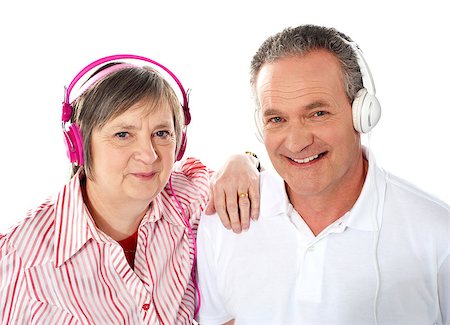 Portrait of a cute senior couple listening to music together against white background Stock Photo - Budget Royalty-Free & Subscription, Code: 400-06768055