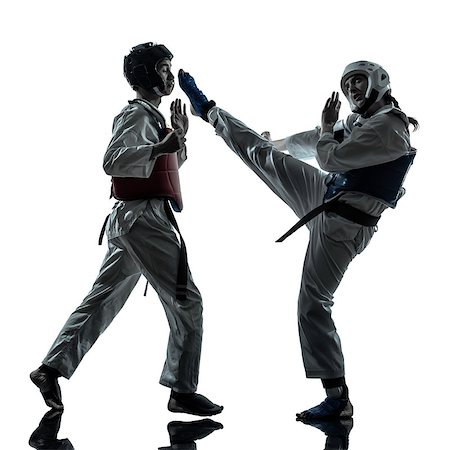 one couple man woman couple exercising karate taekwondo martial arts in silhouette studio isolated on white background Photographie de stock - Aubaine LD & Abonnement, Code: 400-06768326