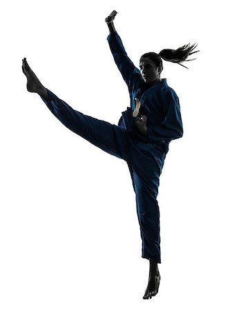 one caucasian woman exercising karate vietvodao martial arts in silhouette studio isolated on white background Photographie de stock - Aubaine LD & Abonnement, Code: 400-06768330
